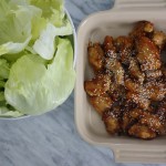 sticky chicken in bowl with lettuce cups