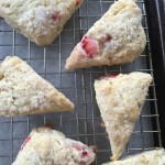 strawberry scone with rhubarb glaze on cooling rack