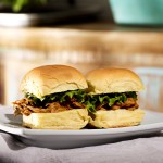 slow cooker pulled pork on bun with lettuce