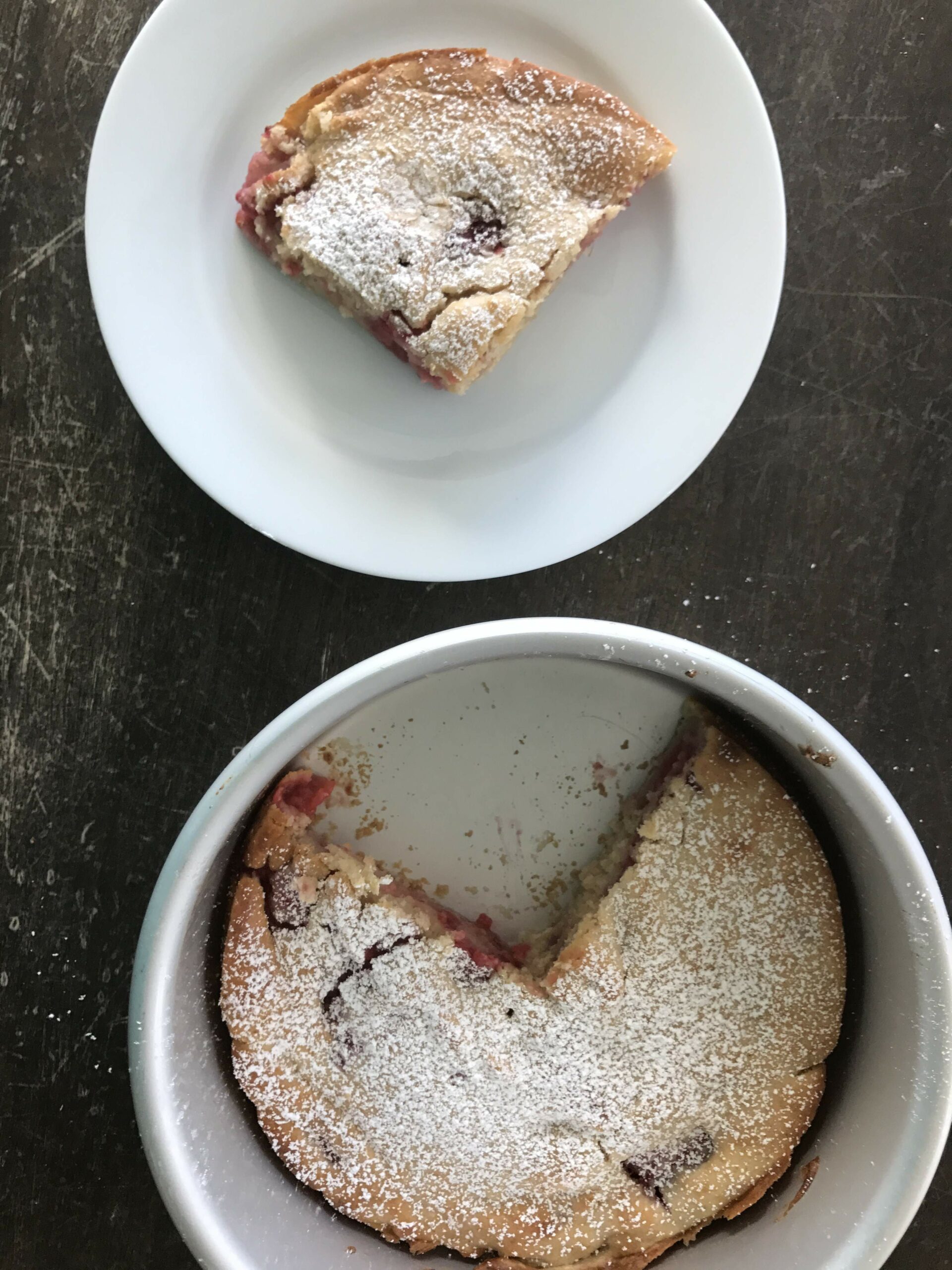 Raspberry Yogurt Cake slice and full cake in bowl