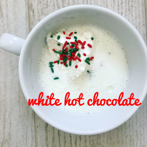 white chocolate hot chocolate with red and green sprinkles