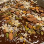 chocolate bark with almonds, pistachios, coconut, and cinnamon